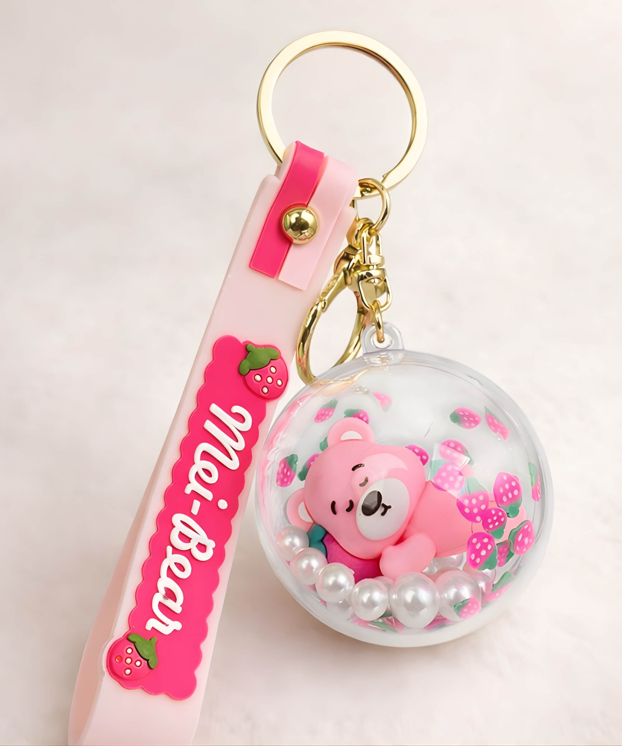 Strawberry bear sleeping shaker keychain with floating beads inside round charm